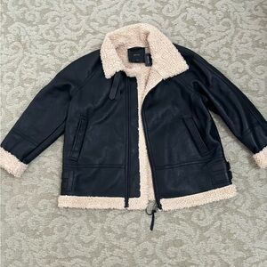 Leather jacket with fur trim